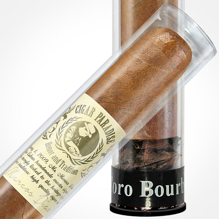 Cigar Paradise Sabores Toro Bourbon 54x6 close-up inside a clear cigar tube, showing the tobacco wrapper, cigar band and Toro Bourbon label.