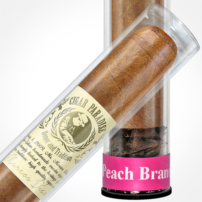 Cigar Paradise Sabores Toro Peach Brandy 54x6 close-up inside a clear cigar tube, showing the tobacco wrapper, cigar band and Toro Peach Brandy label.